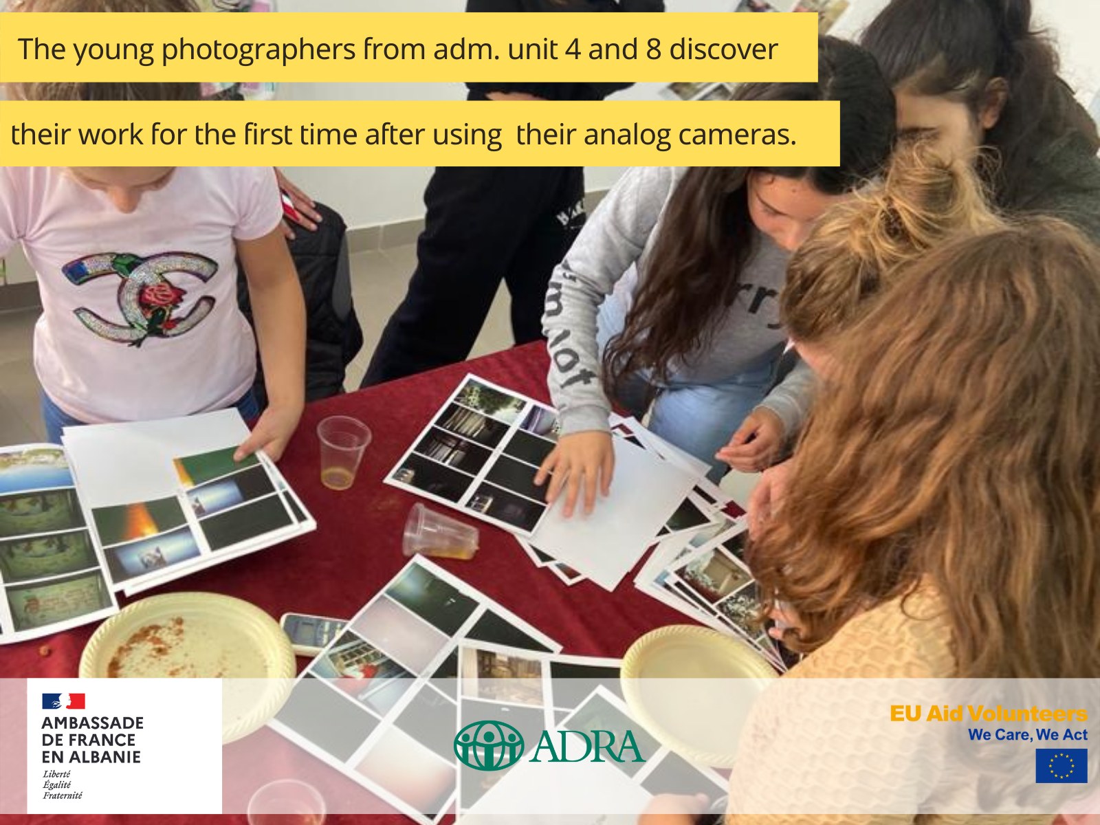 Teenagers in Albania display their photographs