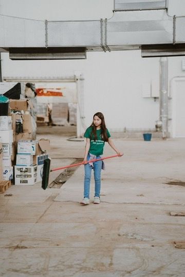 Young volunteers helping in ADRAs warehouse that is being used to sort aid supplies for families affected by the torrential rains around Valencia, Spain